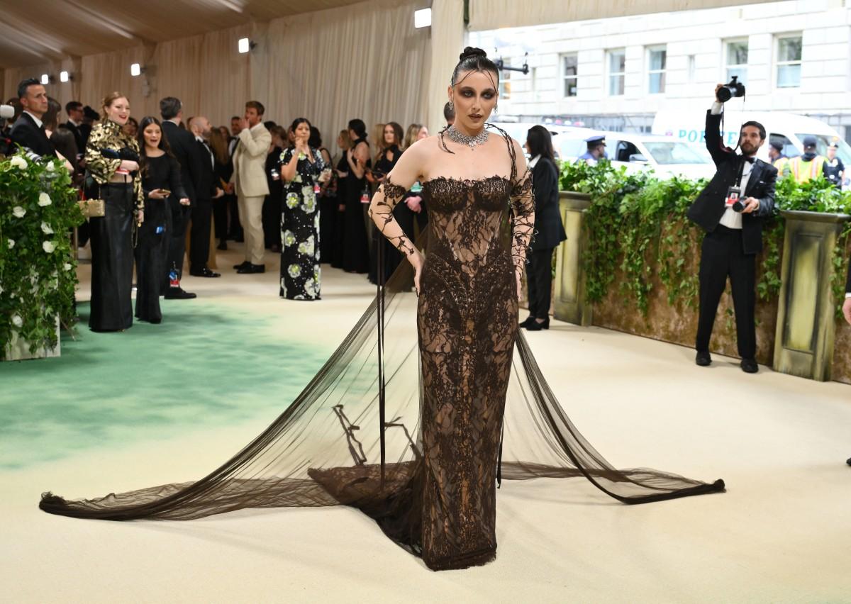 Emma Chamberlain sported a completely new look at the MET Gala 2024 red carpet. This year's theme has brought out her inner Goth, with help from Jean Paul Gaultier