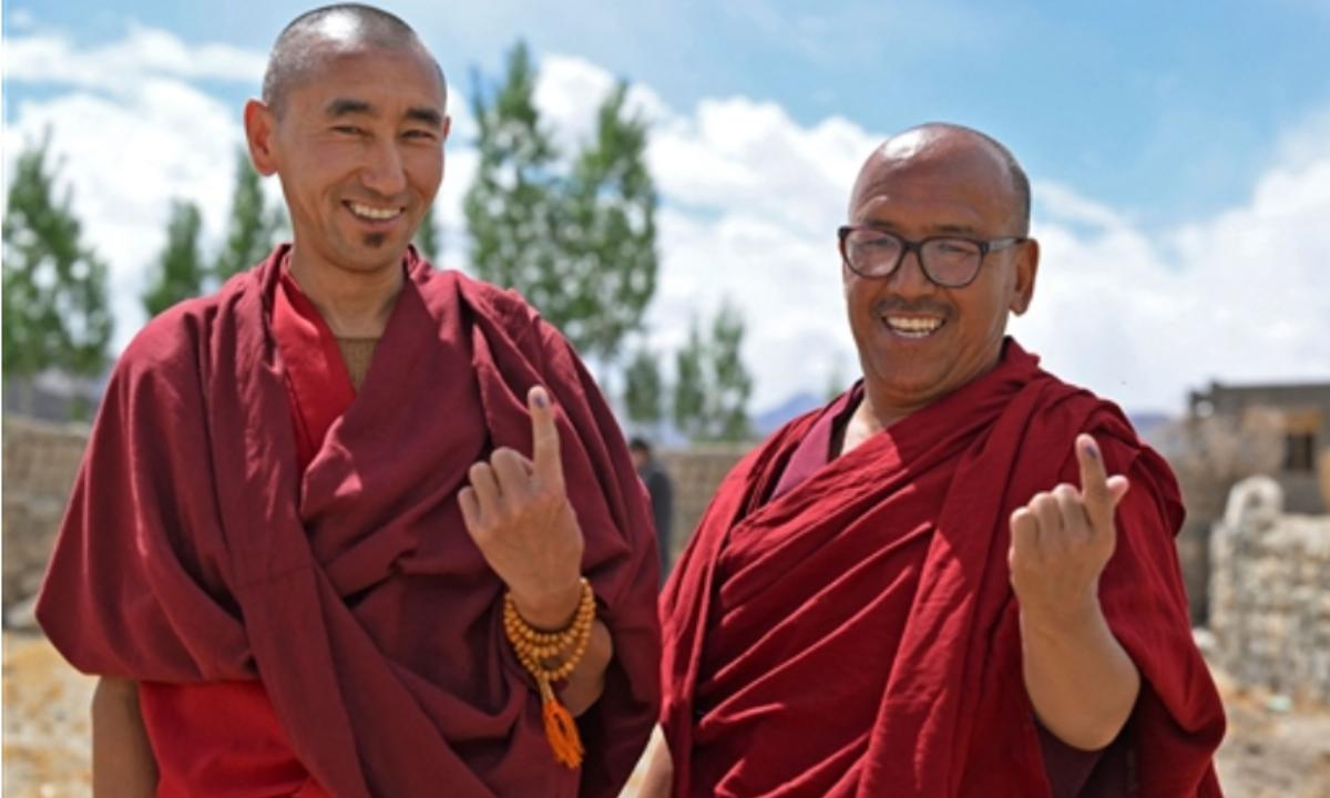 Buddhist Monks proudly show inked fingers after casting their votes in Thiksey, Leh. Two Union Territories- Ladakh and Jammu and Kashmir- go to the ballot in the India General Elections 2024.