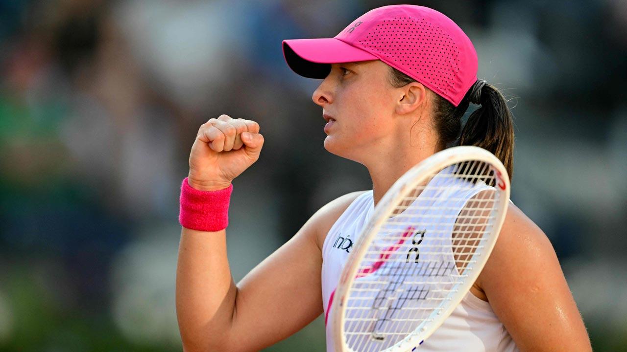 Poland`s Iga Swiatek celebrates after winning against USA`s Coco Gauff at the Women`s WTA Rome Open tennis tournament at Foro Italico in Rome