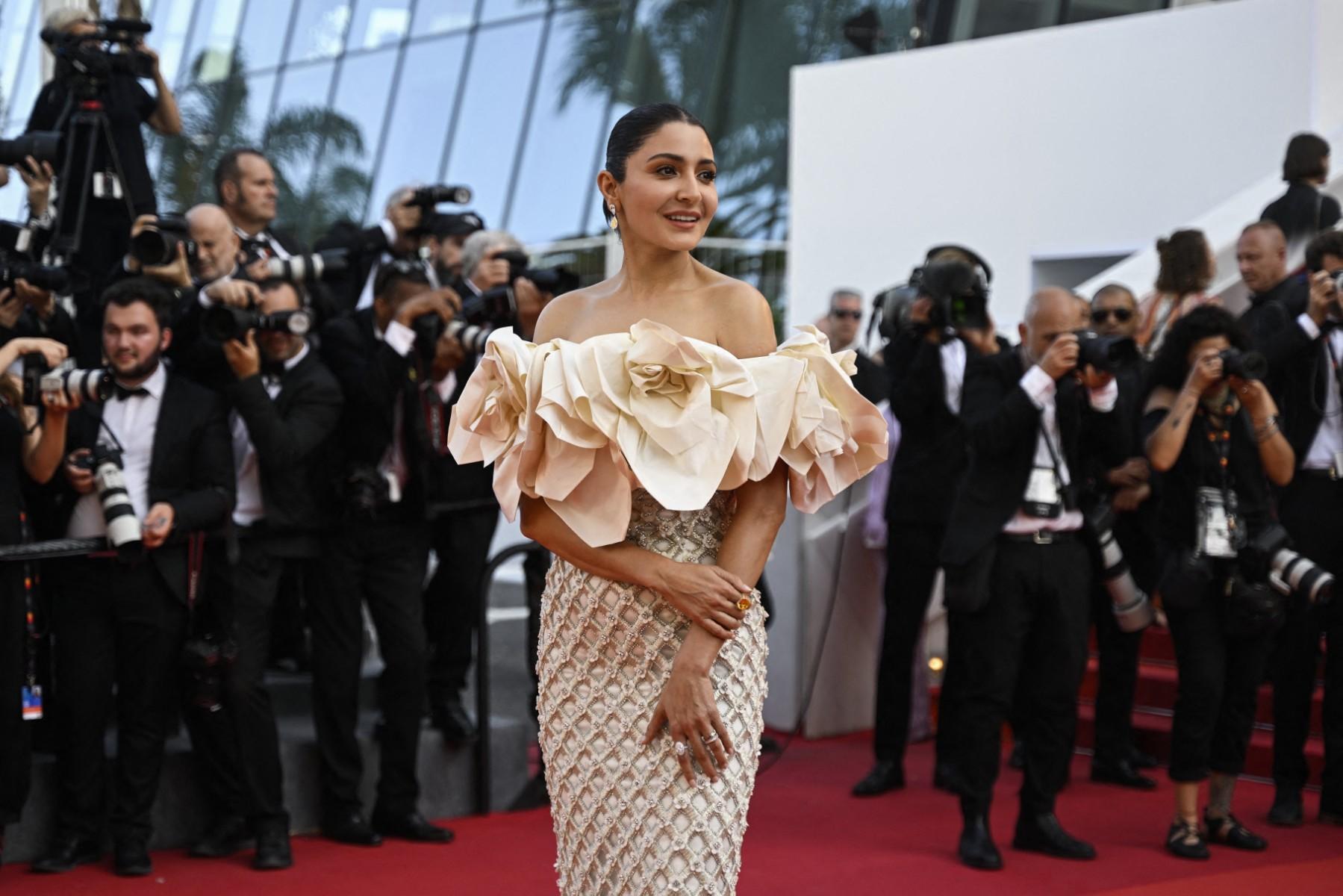 For her Cannes debut, Anushka Sharma wore a cream-coloured dress designed by Richard Quinn from his Fall 2023 ready-to-wear collection.