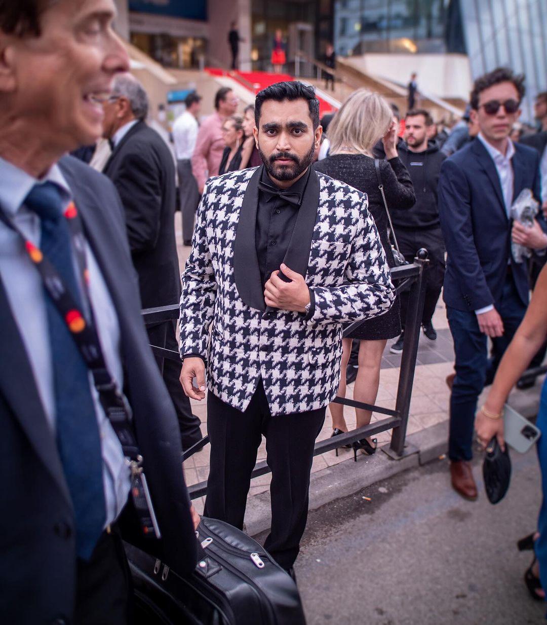 Viraj Ghelani turns heads in a striking black and white suit at the 77th Cannes Film Festival.