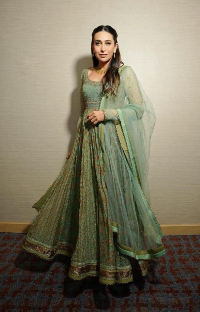 Karisma Kapoor looked stunning in a green Ritu Kumar Anarkali dress. 
