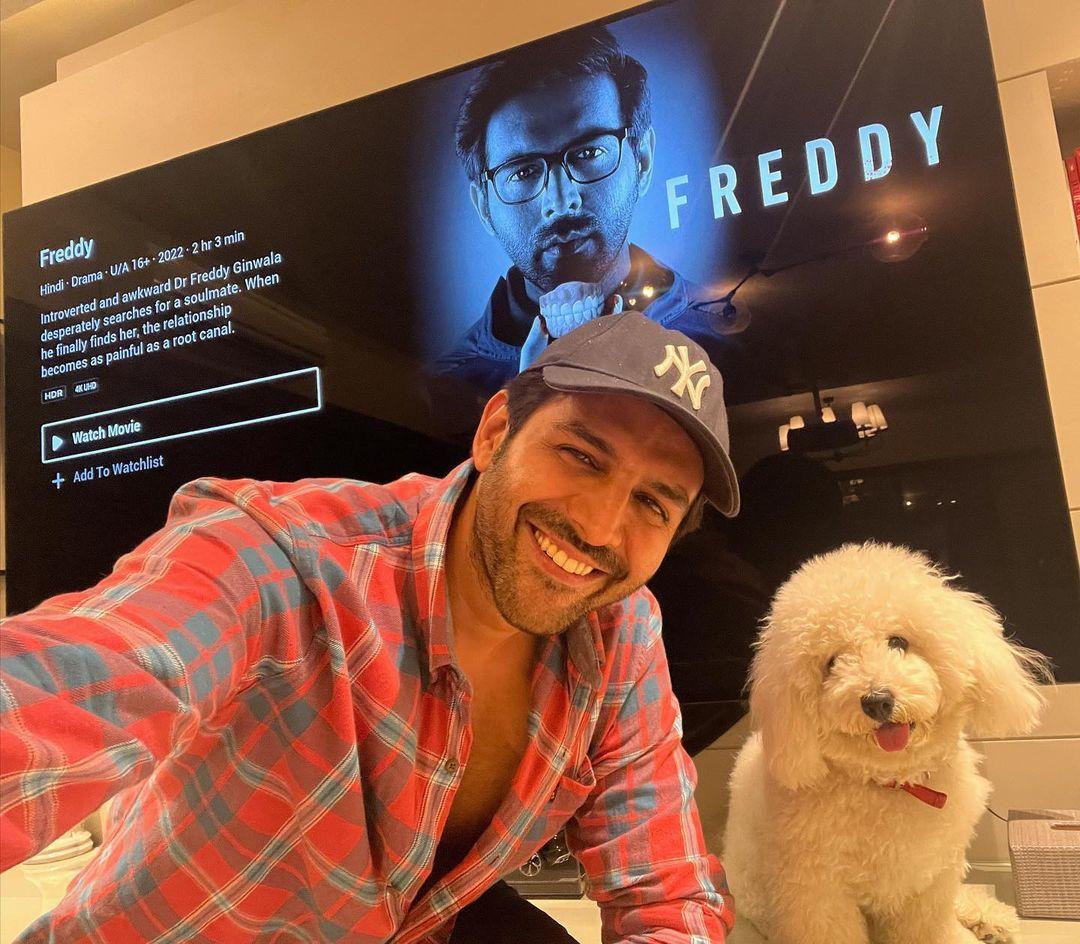 In this pic, Kartik enjoys time with his little friend as they celebrate his film Freddy's release