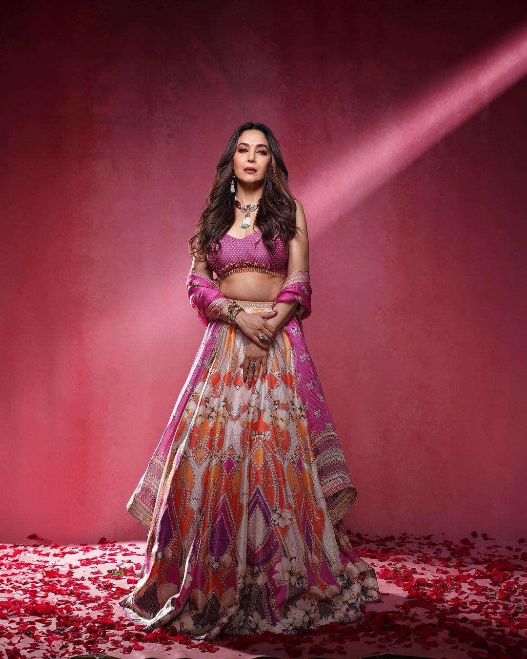 Madhuri Dixit looked stunning in a pink lehenga with colourful accents at the bottom