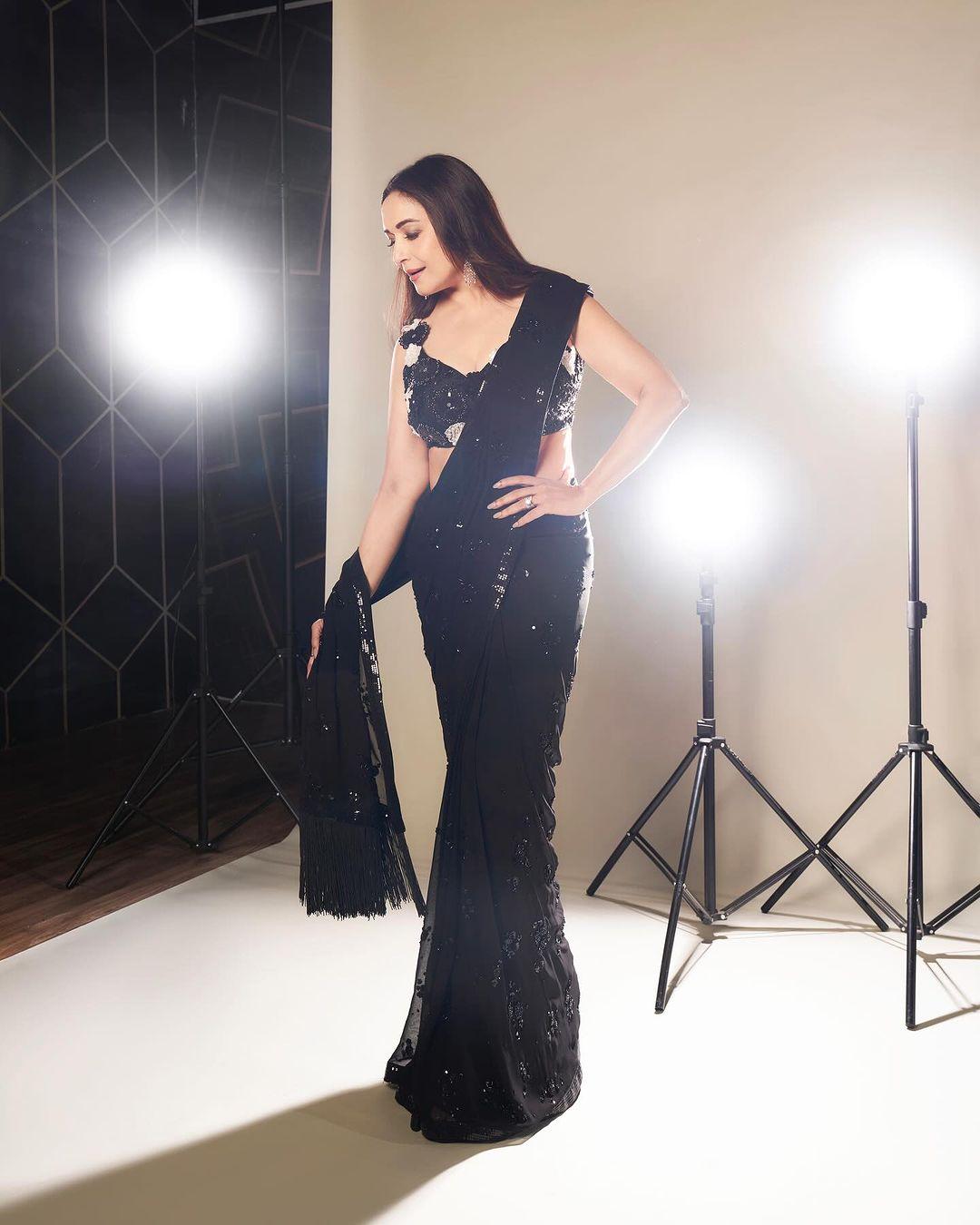 Madhuri Dixit recently wore a saree that sparkled with tiny shimmering details along the edges and all over the fabric.