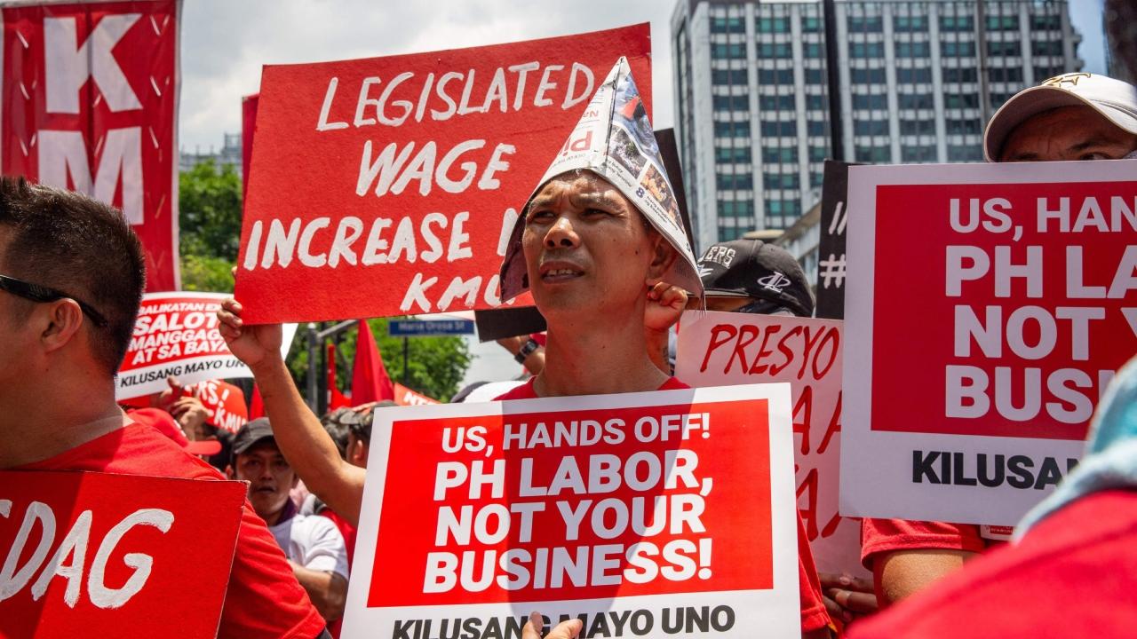 The protesters rallied in the street, where they chanted and delivered speeches about the difficulties faced by Filipino labourers