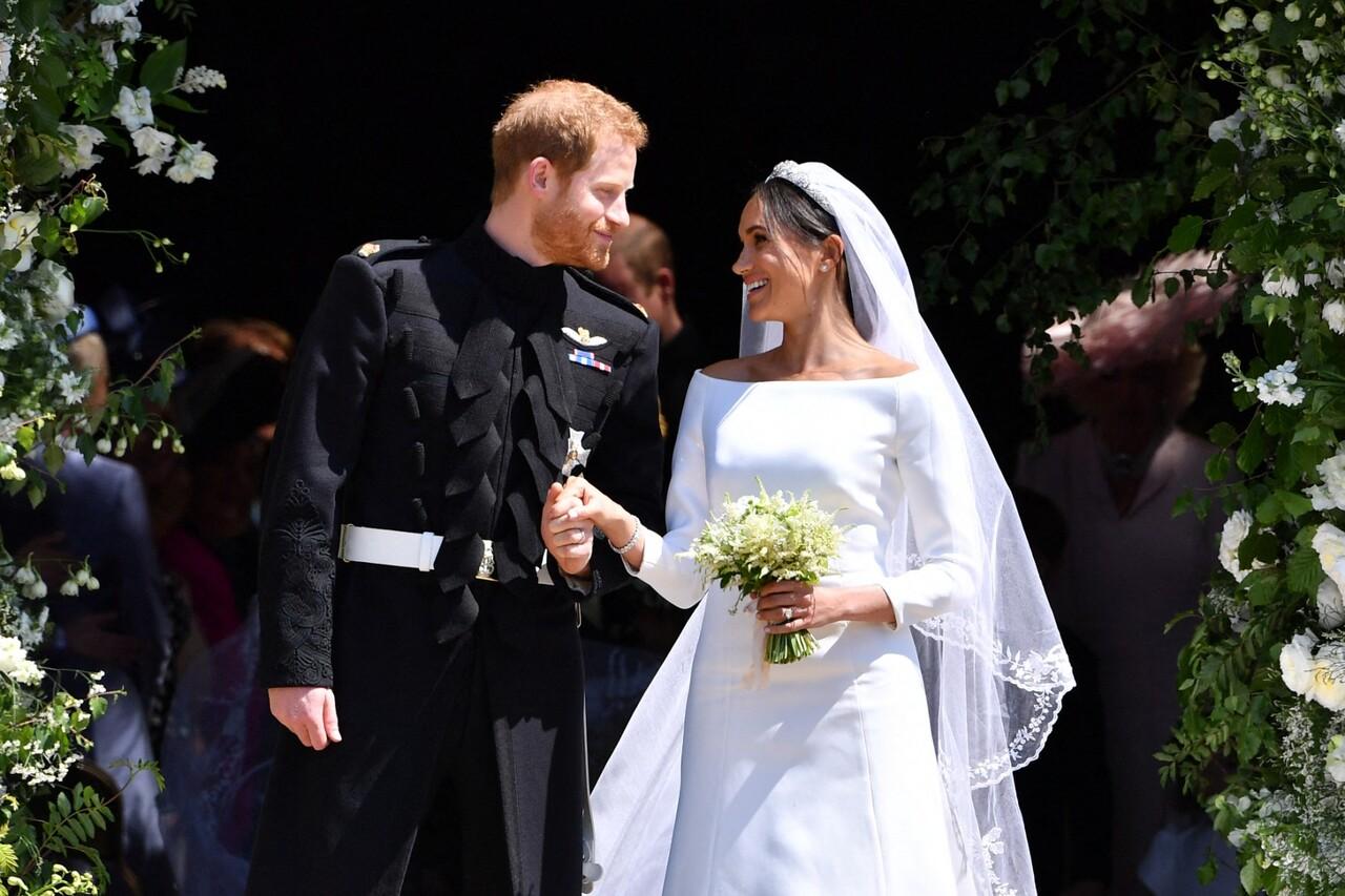 Former actress Meghan Markle who married Prince Harry in 2018 wore a a boat-necked, sculpted white dress for her Royal wedding, designed by British designer, Clare Waight Keller of French Fashion House Givenchy, and complimented her look with a Tiara.