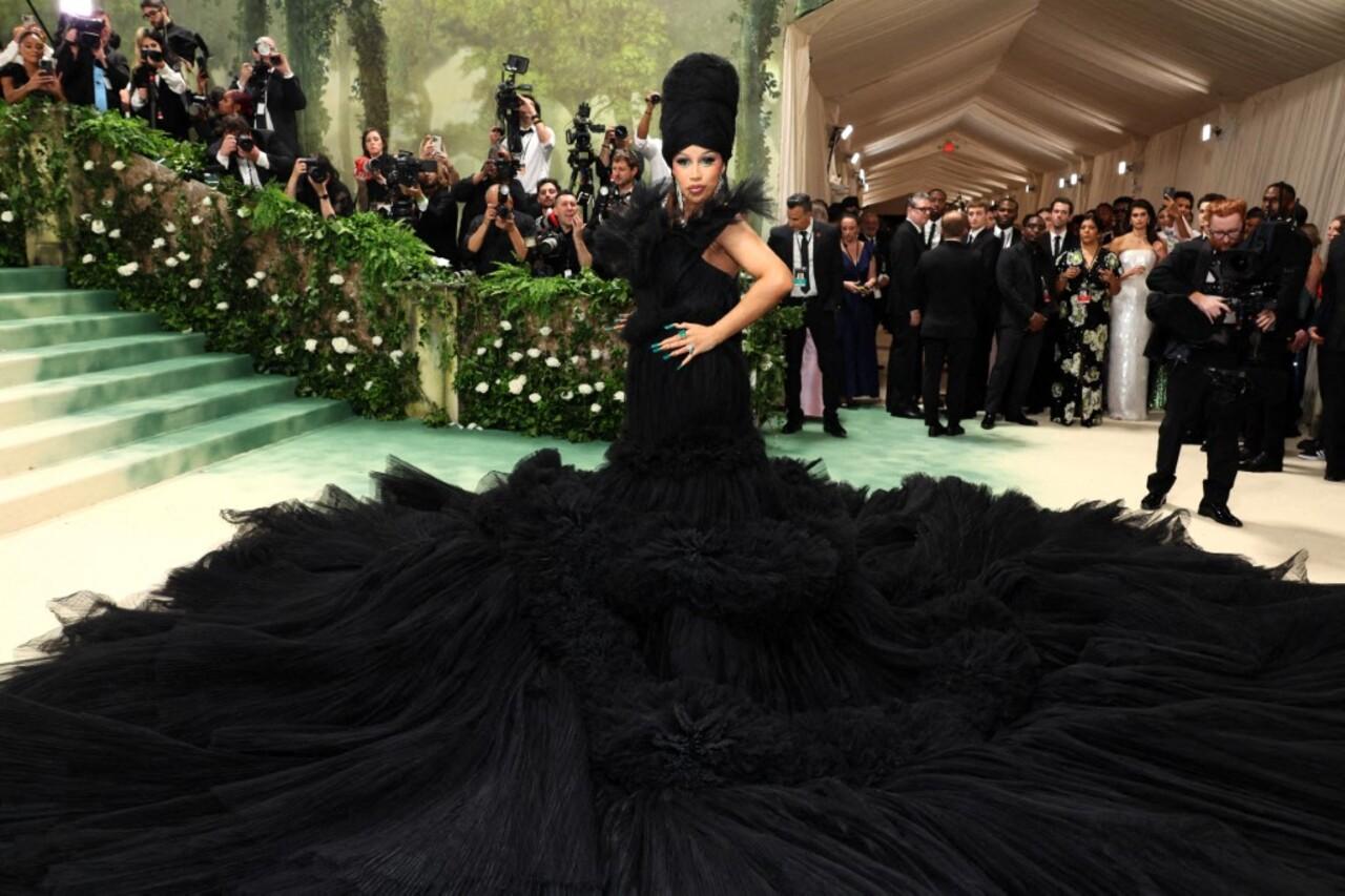 Known for her bold fashion choices, Cardi B left heads turning and jaws dropping as she made her entrance in a monumental black tulle gown that could only be described as a work of art. The creation by Chinese designer Windowsen however, reminds one of a massive chunk of hair. 