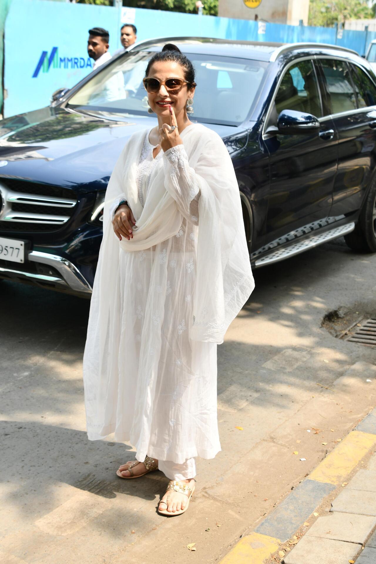 Actress Vidya Balan stuns in an all-white outfit for casting her vote