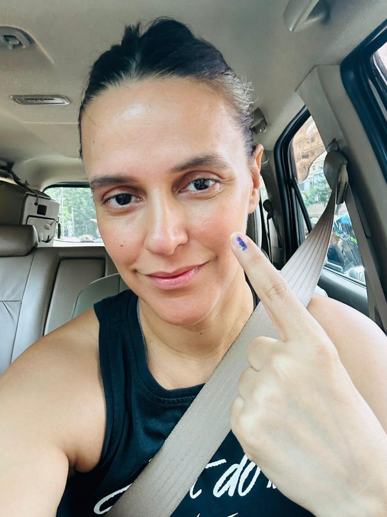 Neha Dhupia flaunts her inked finger on Monday morning after casting her vote in Mumbai