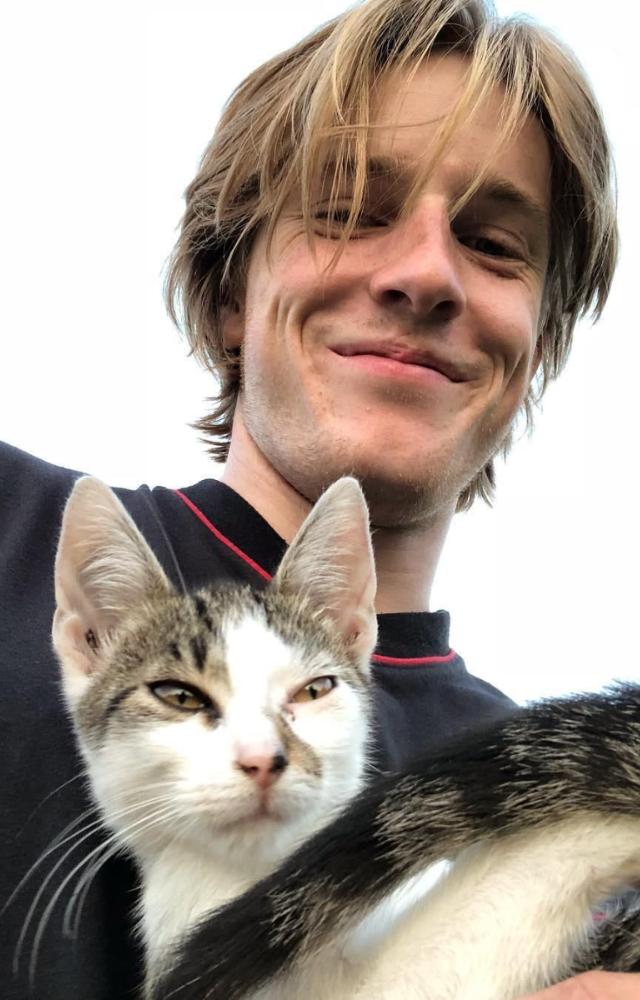 Jake Bongiovi looks ever so content with his pet cat