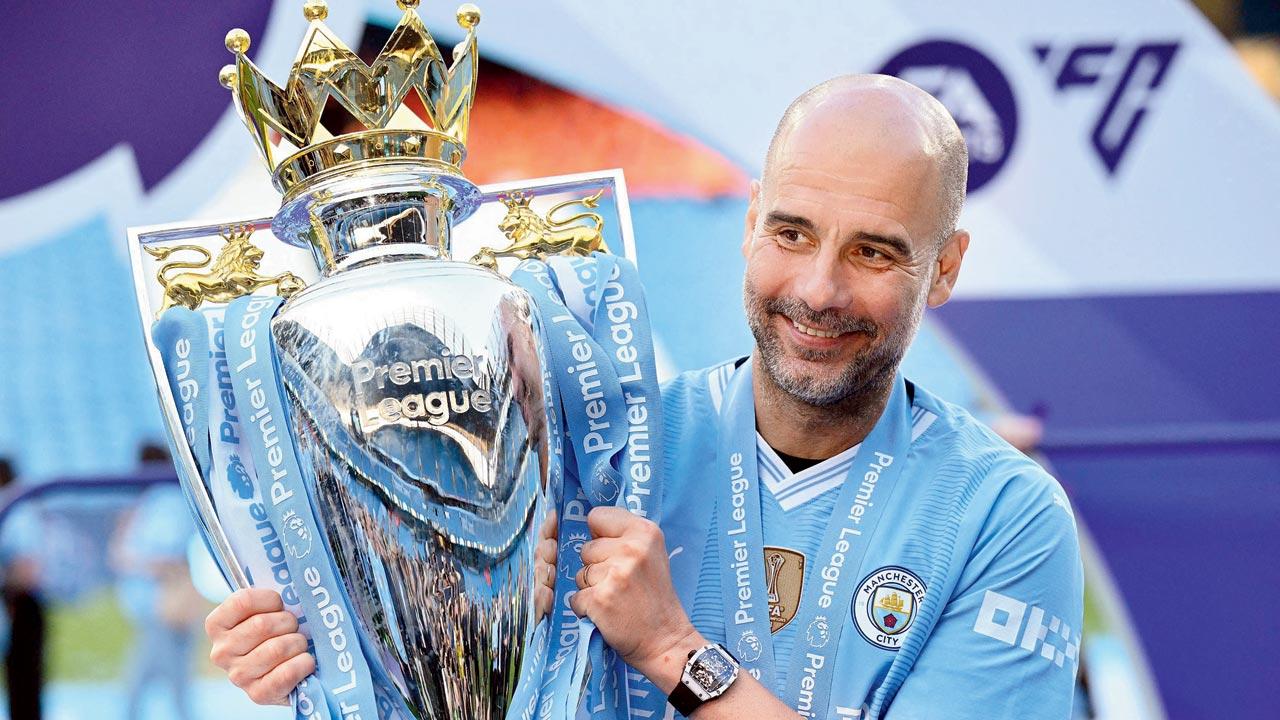 Man City boss Pep Guardiola with the EPL trophy on Sunday