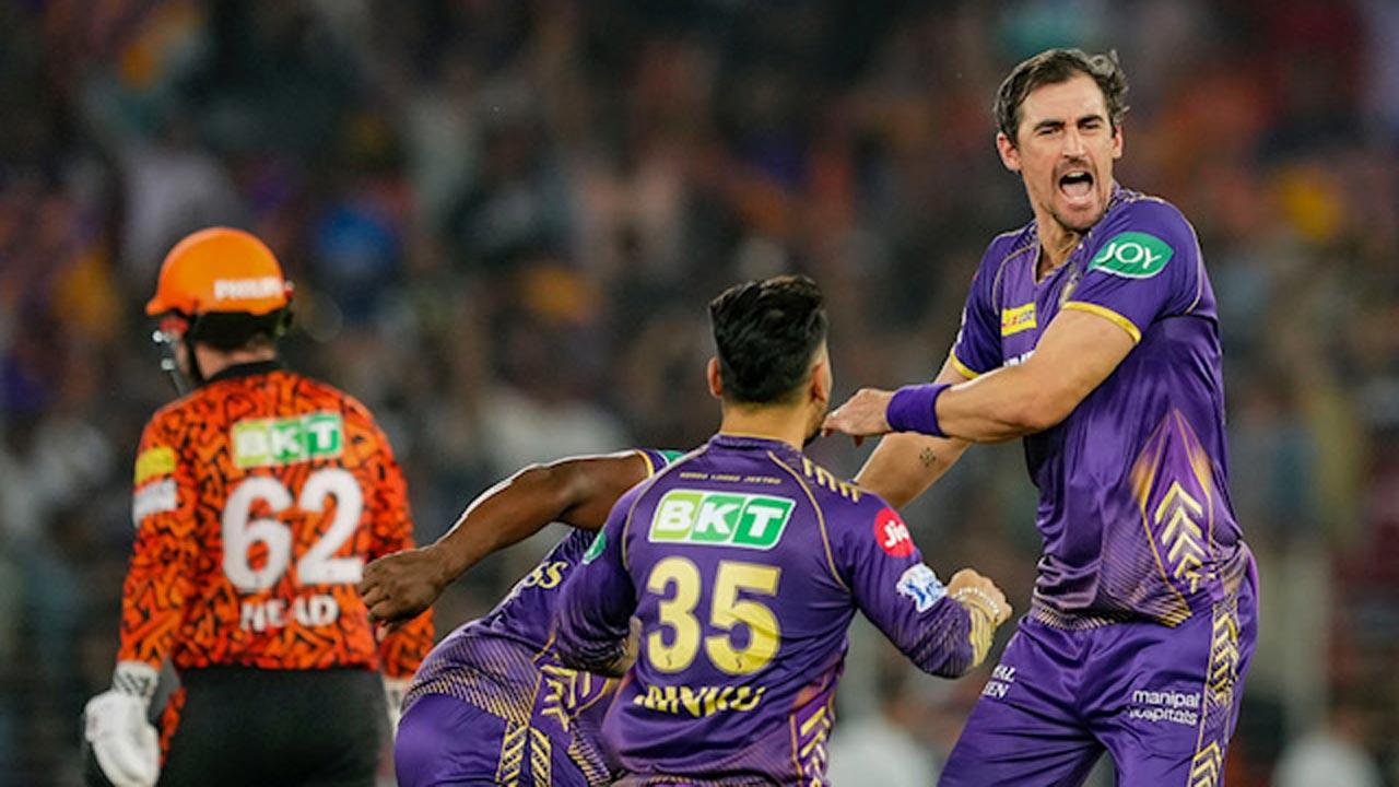 KKR pacer Mitchell Starc (right) with teammates after dismissing SRH’s Travis Head. Pic/PTI