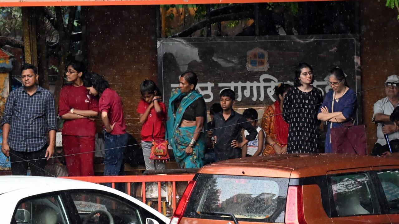 Several trees in Thane were also uprooted due to dust storm and rains on Monday