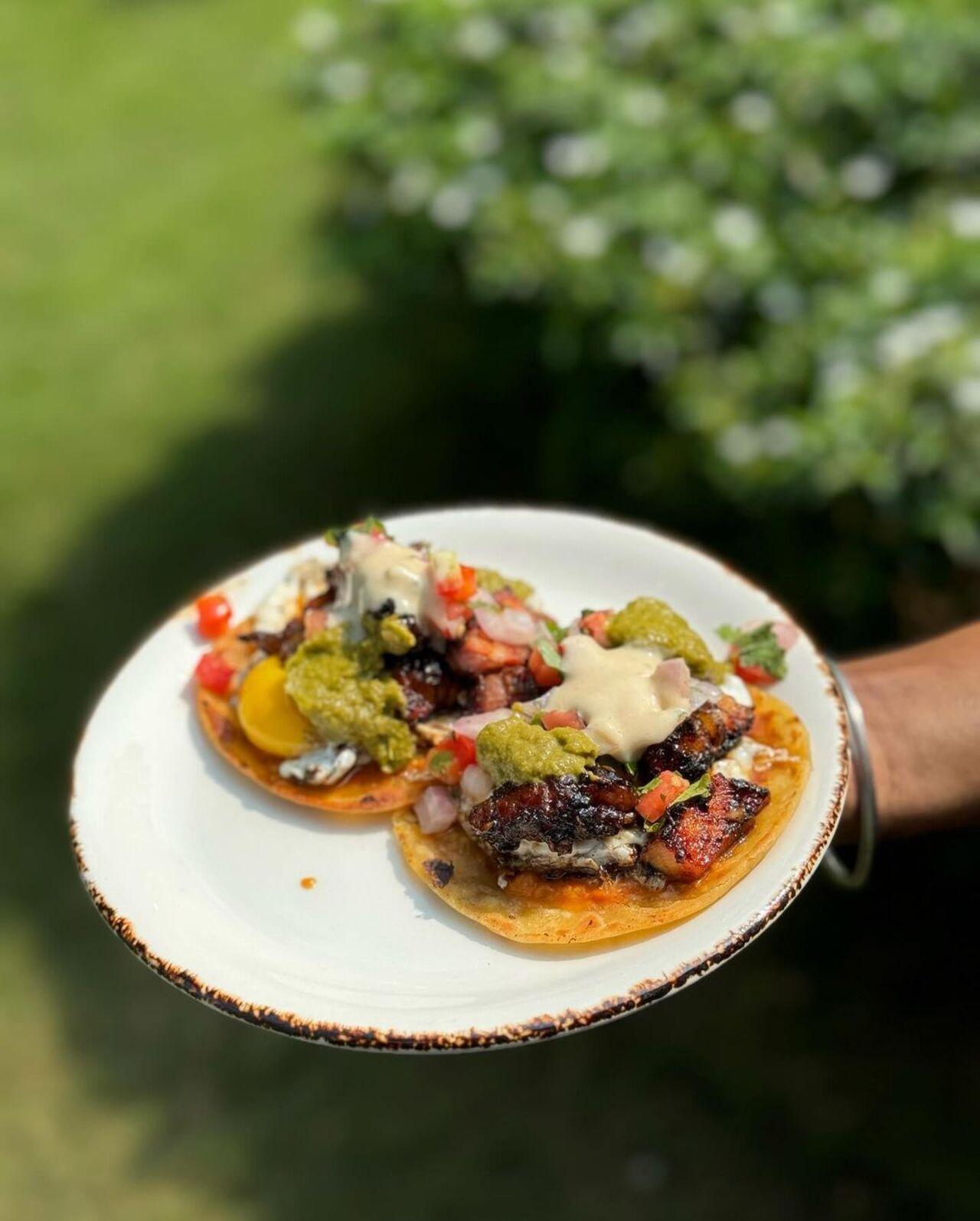 There’s no way you can get past this plate of soft tacos topped with salsa, guacamole, and a whole bunch of other things. 