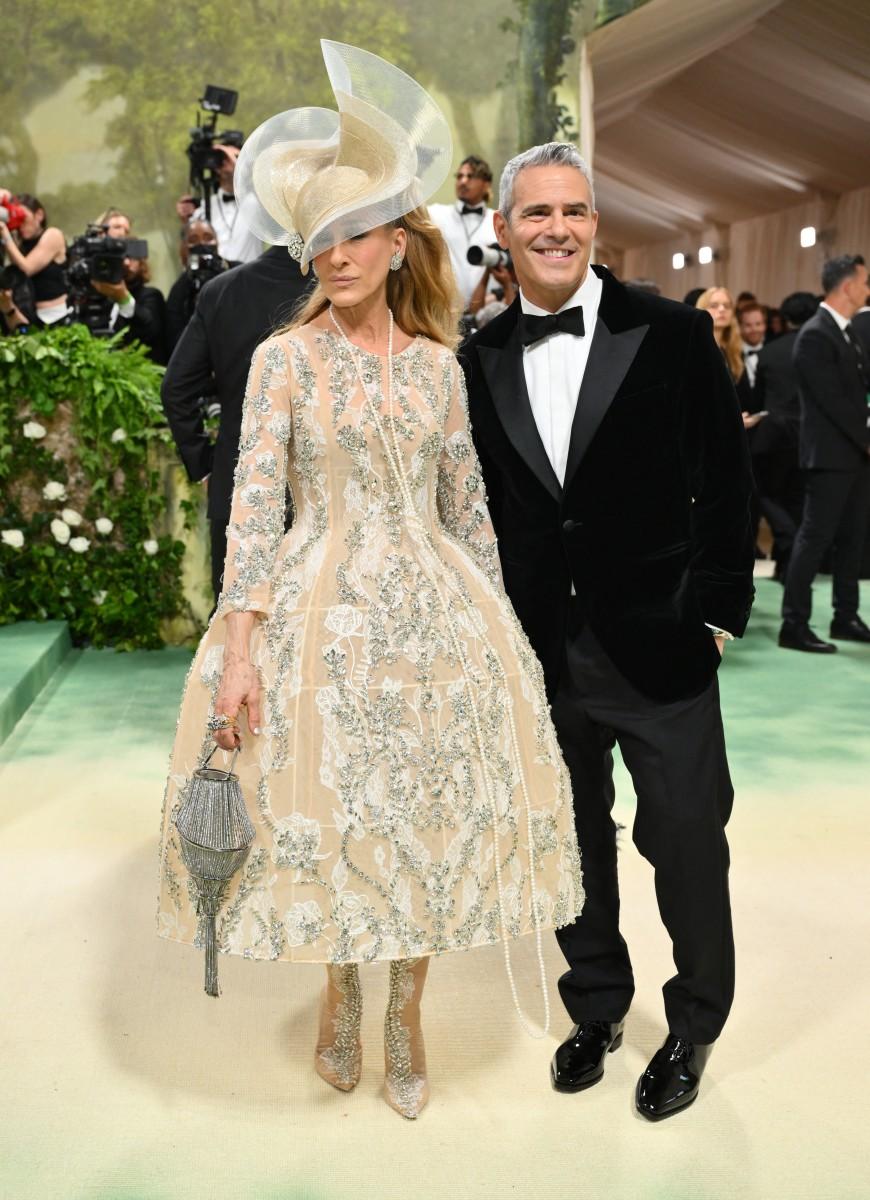 Sarah Jessica Parker made a triumphant return to the Met Gala red carpet, channelling her iconic character Carrie Bradshaw with a massive headpiece. And, of course, Andy Cohen was her escort!