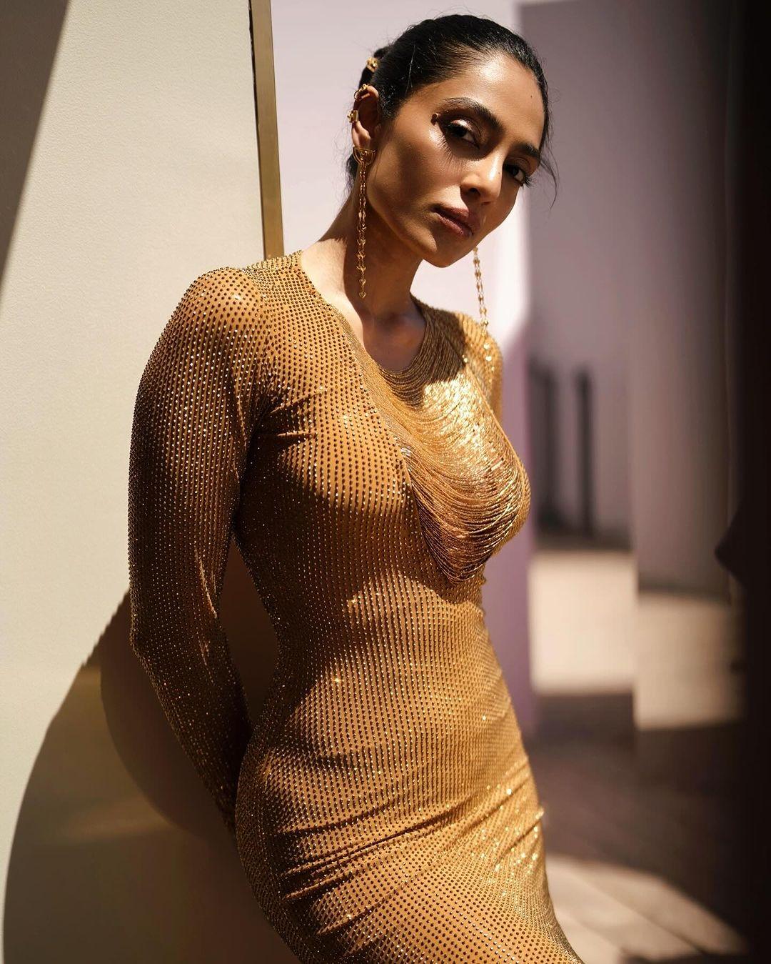 At Cannes 2024, Sobhita chose a fancy golden bodycon dress with long sleeves.