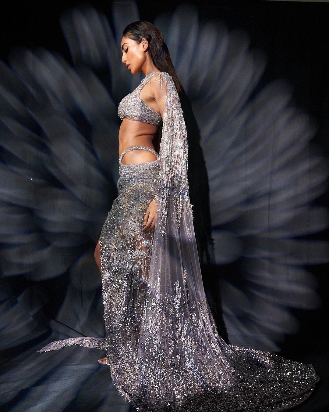 She completed the look with a matching transparent dupatta that had tassels, sequin embroidery, and a floor-sweeping train.