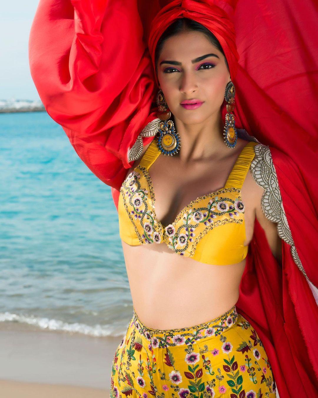 At this glamorous Cannes event, Sonam chose another ensemble by Anamika Khanna, opting for a vibrant yellow co-ord skirt and blouse set paired with a stunning red kaftan.