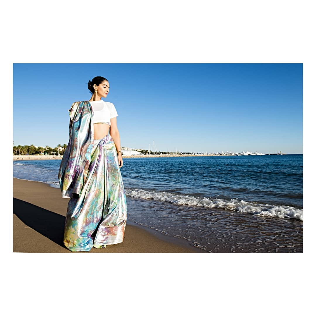 The actress, who landed at the French Riviera on Friday accompanied by her sister Rhea Kapoor, turned heads in a stunning NorBlack NorWhite saree adorned with a prismatic design. She paired it with a white blouse, completing the chic ensemble.