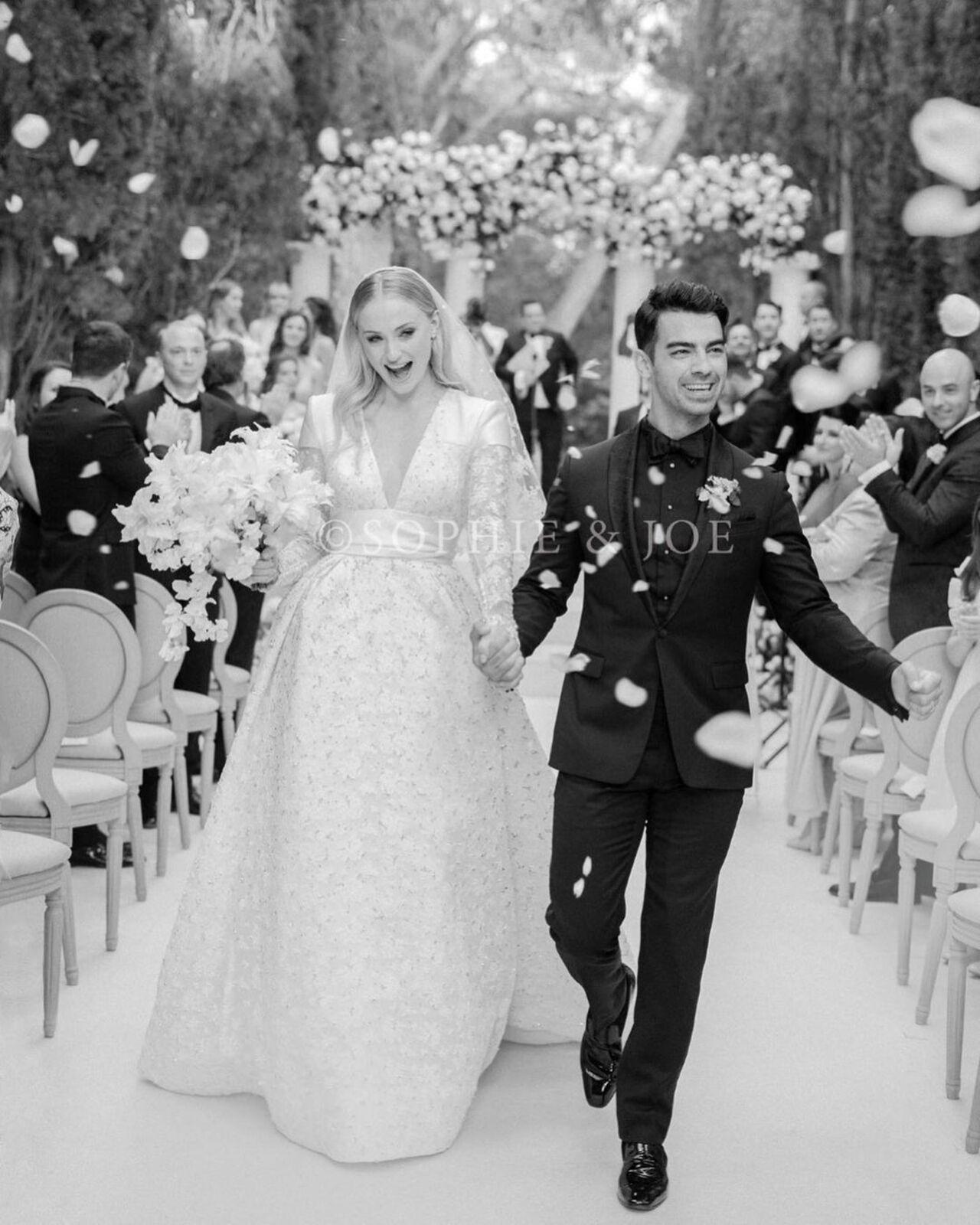 Actor Sophie Turner and singer Joe Jonas had a lavish ceremony in France in 2019. Sophie looked breathtaking in her wedding dress, which looked nothing less than a dream, courtesy -- Louis Vuitton. It was a stunning silk Gazar gown with flower-embroidered tulle which featured an optical white leather satin belt and included over 14 meters of embroidered tulle using floral patterned thread. 