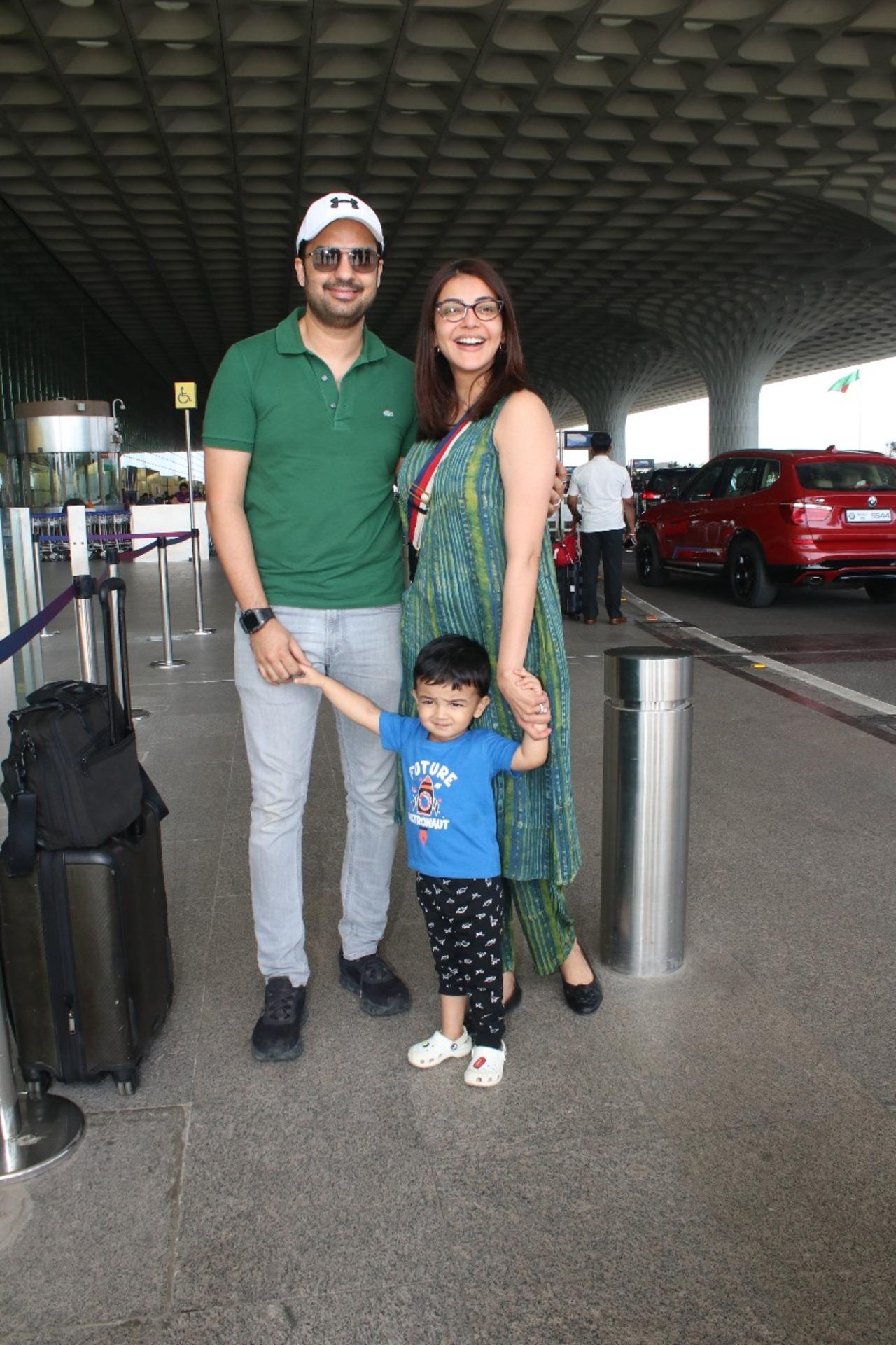 Kajal Aggarwal posed with her husband and son at the airport