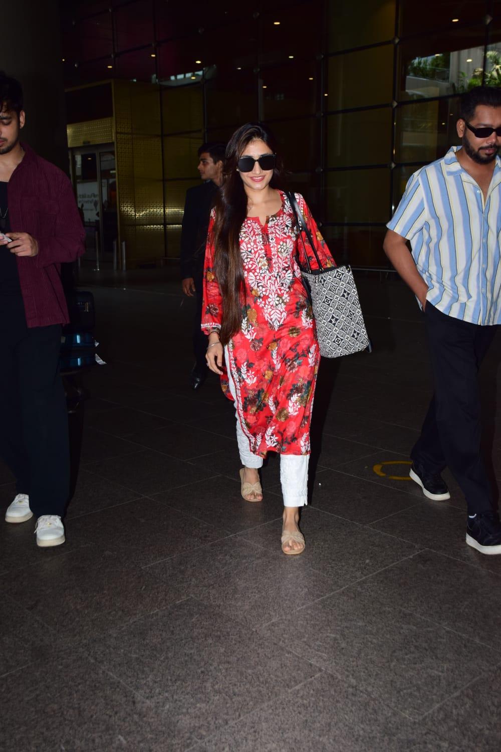Dhanashree was clicked at the airport as she returned to the city
