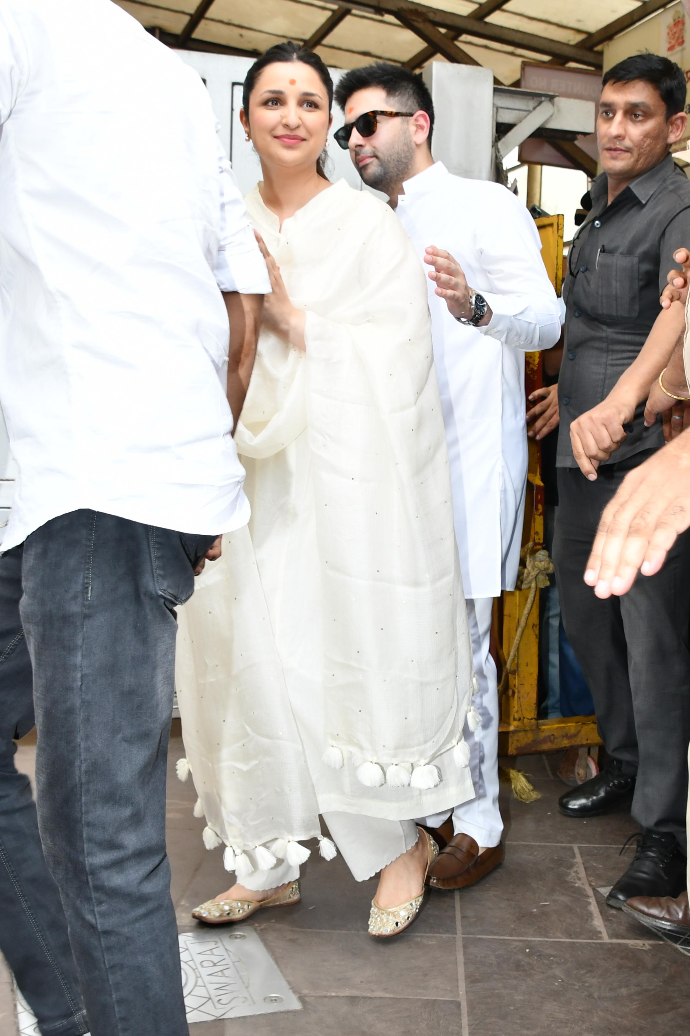 The couple were clad in all-white ensembles as they stopped by to do darshan
