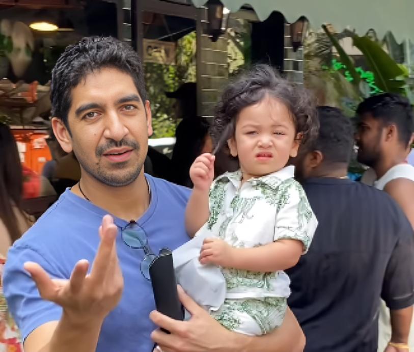 On Sunday morning, Ayan was seen fulfilling his chachu duties with Raha, as she held onto him while he grabbed a snack at a cafe in Mumbai's Bandra neighbourhood. (Pic/Instant Bollywood)