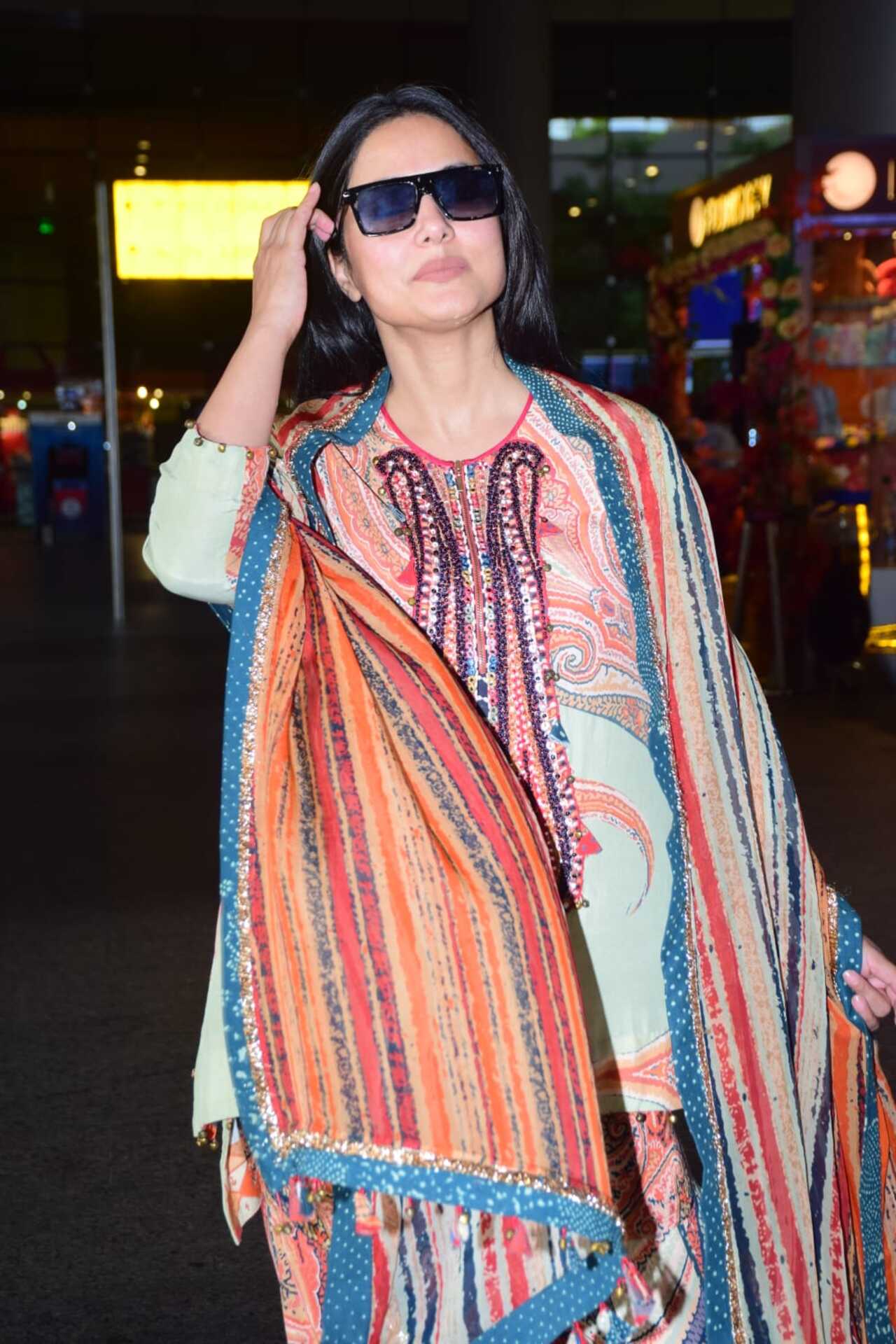 Hina Khan exuded elegance in a multi-colour printed outfit at the Mumbai airport. 