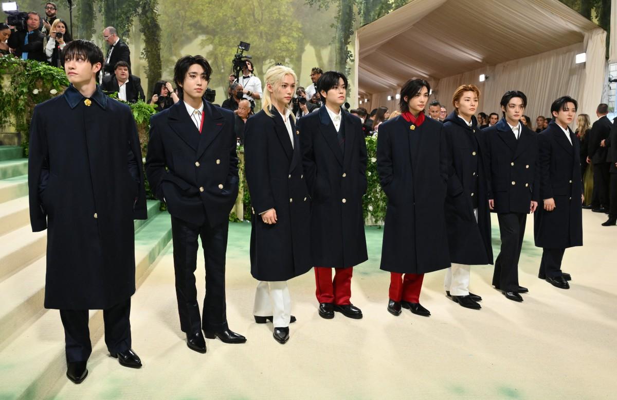 Korean boy band Stray Kids made their Met Gala debut in style, donning custom Hilfiger outfits for the occasion.