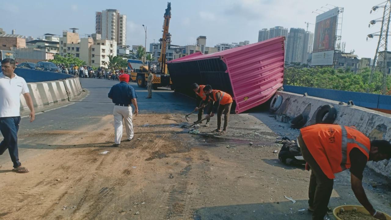 Traffic was slowly moving on the busy road from 9 am, the official said, adding that the container driver fled the scene after the accident