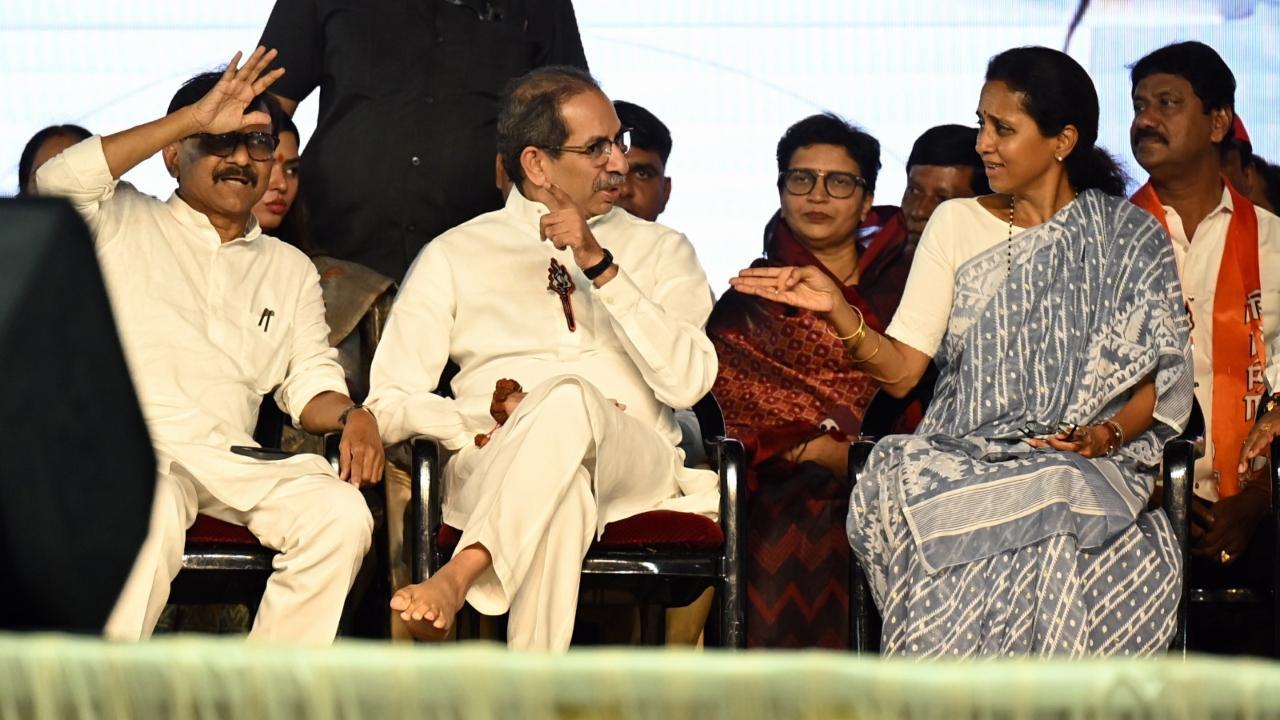 Uddhav was seen sharing the stage with Supriya Sule and Sanjay Raut. Pics/Sameer Markande