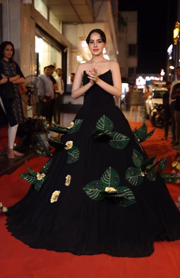 Posing on a red carpet, wearing a beautiful, magical 3D outfit, Uorfi dazzled as the butterflies opened up and fluttered from the flower bulbs in her dress.