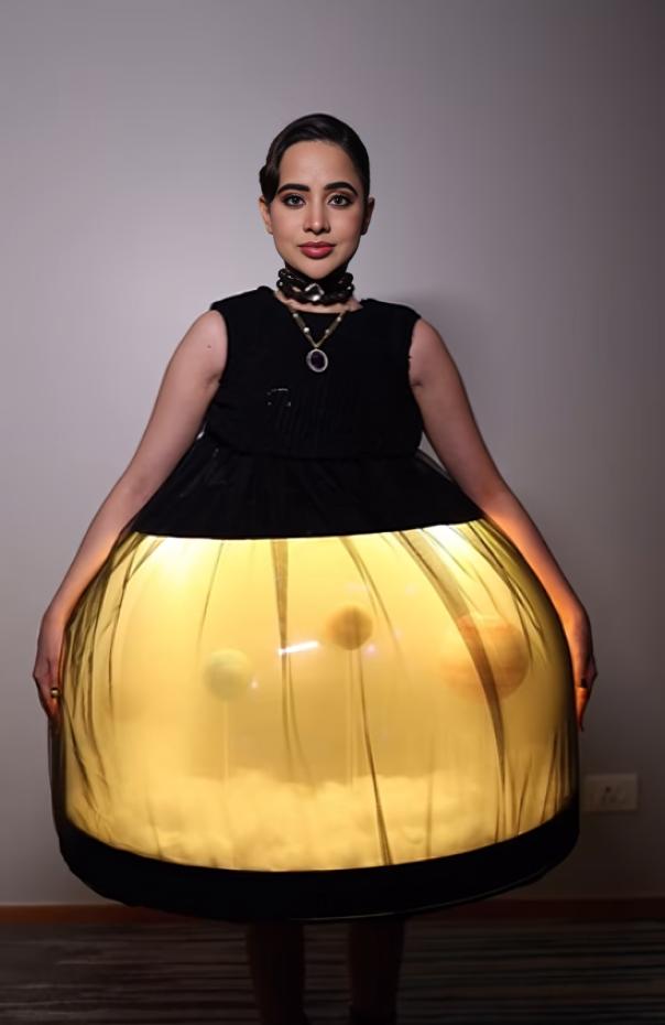 A couple of weeks ago, Uorfi had rocked a terrarium dress, featuring a solar system model inside a glass enclosure.