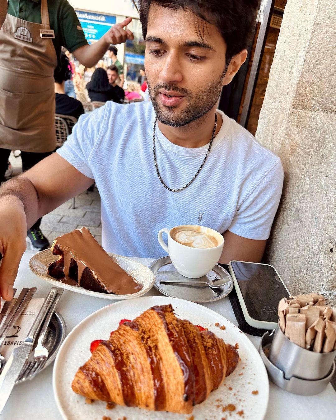 Vijay Deverakonda's summer style shines as he dons a cool blue cotton t-shirt, perfect for vacation vibes.