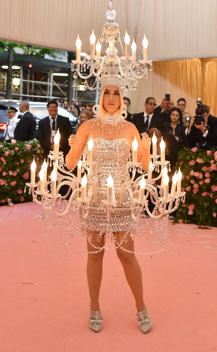 Her Moschino dress was covered in silver jewels and had three layers of candles that actually lit up, with the top one sitting on her head.