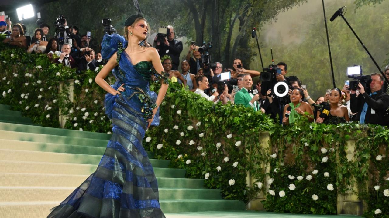 Making her grand entrance at the Met Gala, Zendaya mesmerised in an ocean blue Maison Margiela gown by John Galliano, complete with a stunning matching headpiece by Stephen Jones for Margiela. Pic/AFP