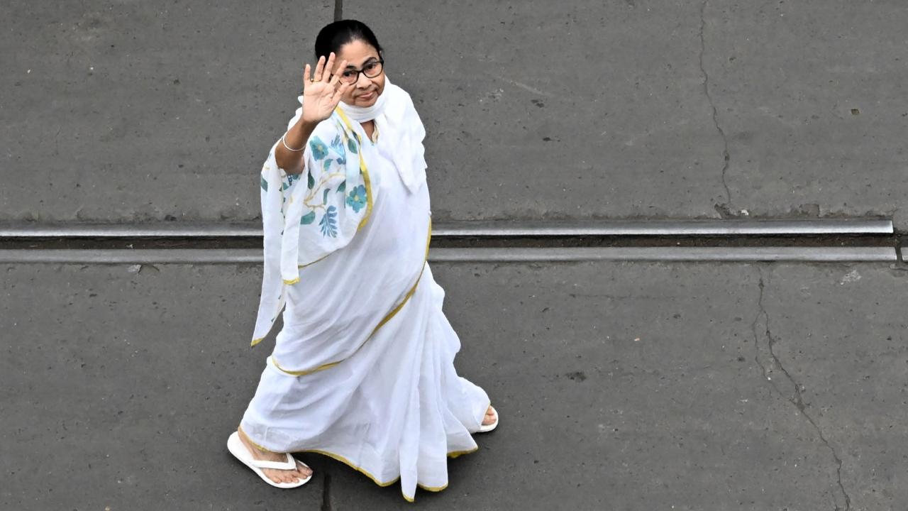 Mamata Banerjee
West Bengal Chief Minister Mamata Banerjee is always spotted wearing her signature white sarees. It has become her style statement. (Pics: AFP)