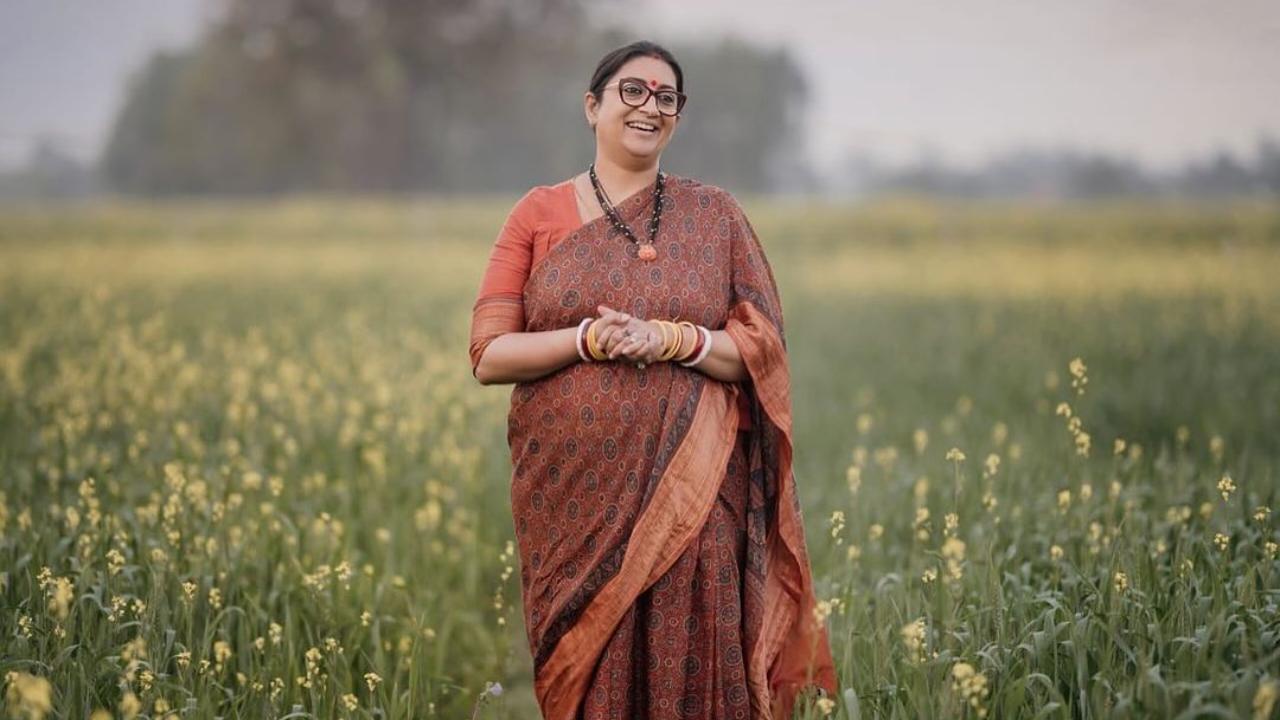 In this picture from Amethi, she is seen wearing a printed ethnic saree with an orange elbow-length-sleeved blouse. She completes the look with a statement neckpiece. 