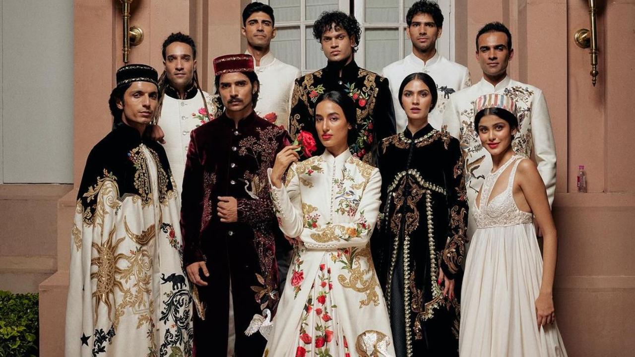 The colour palette of black, red, ivory and gold personalised elegance on the runway.