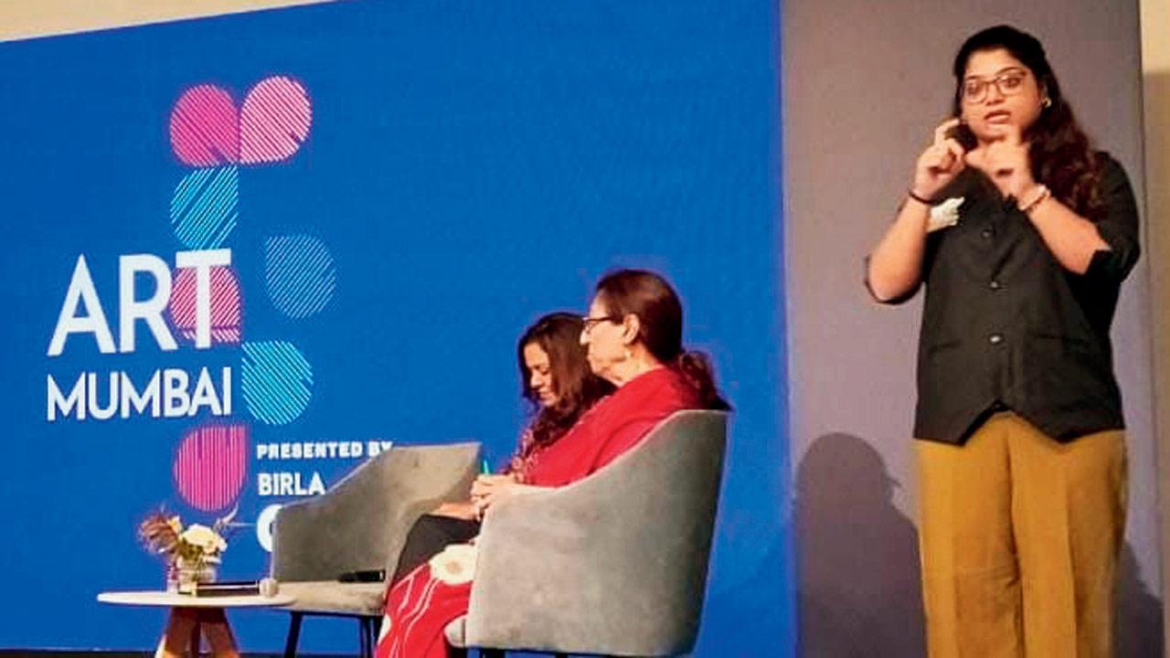 An ISL interpreter translates for the audience