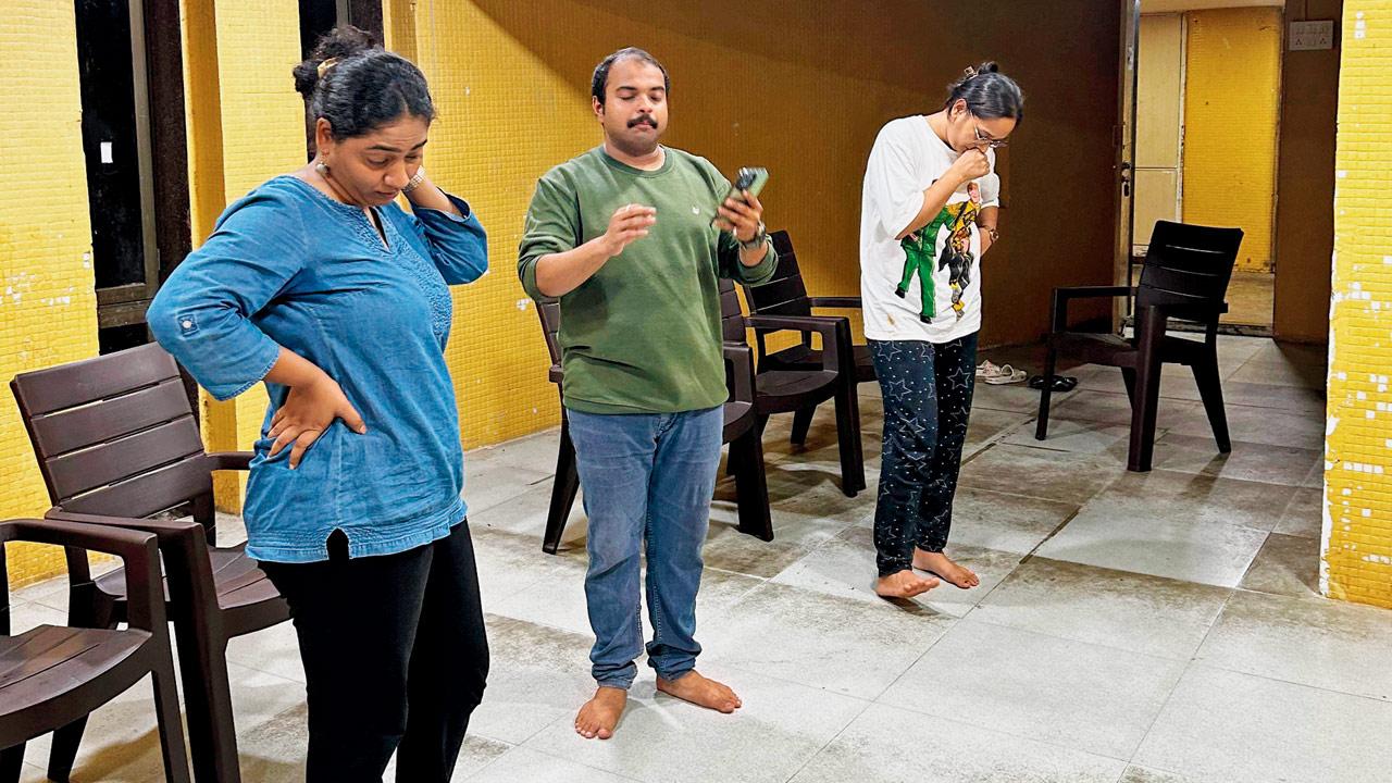 Actors prepare their lines during rehearsals