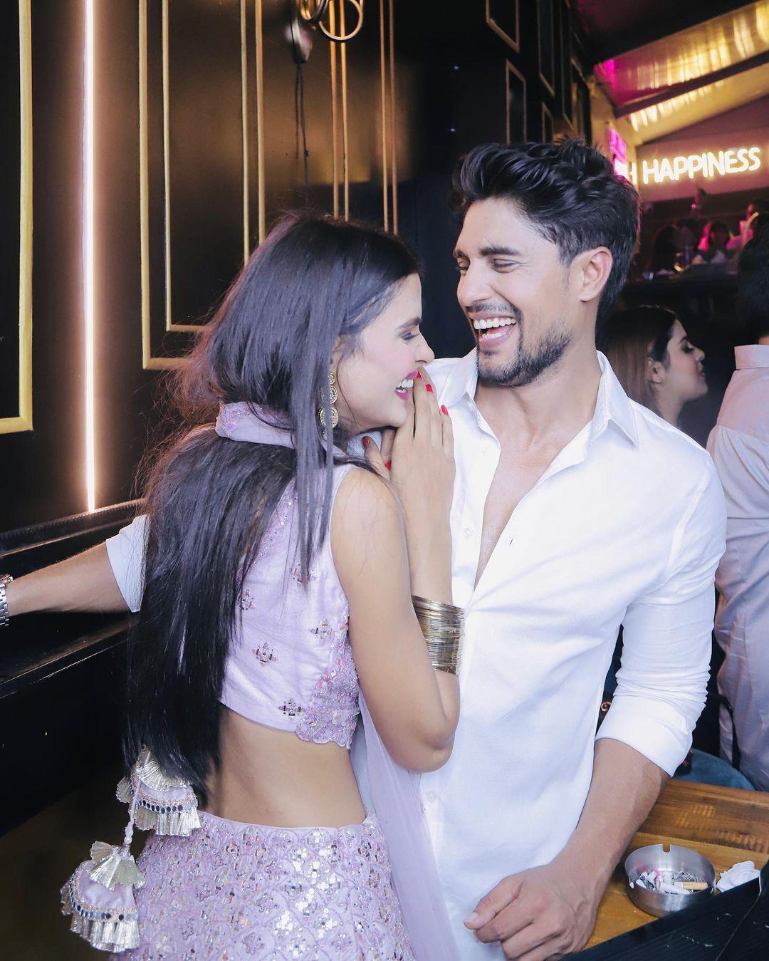 In this look, Ankit wore a plain white shirt paired with simple pants, while Priyanka complemented him in a purple lehenga with heavy embroidery.