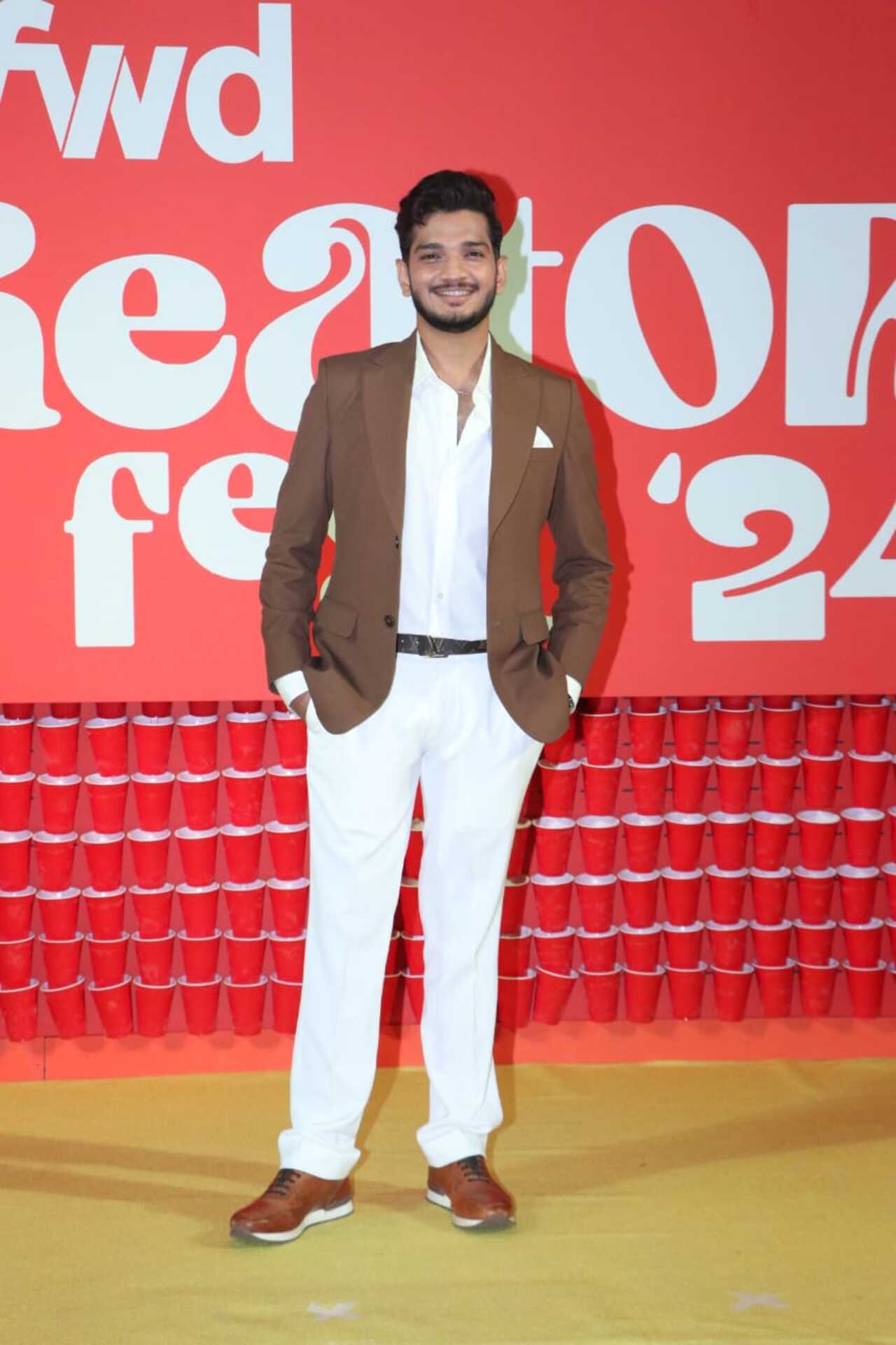 Stand up comedian and Bigg Boss 17 winner Munawar Faruqui slayed his look in a white shirt and pant paired with beige blazer