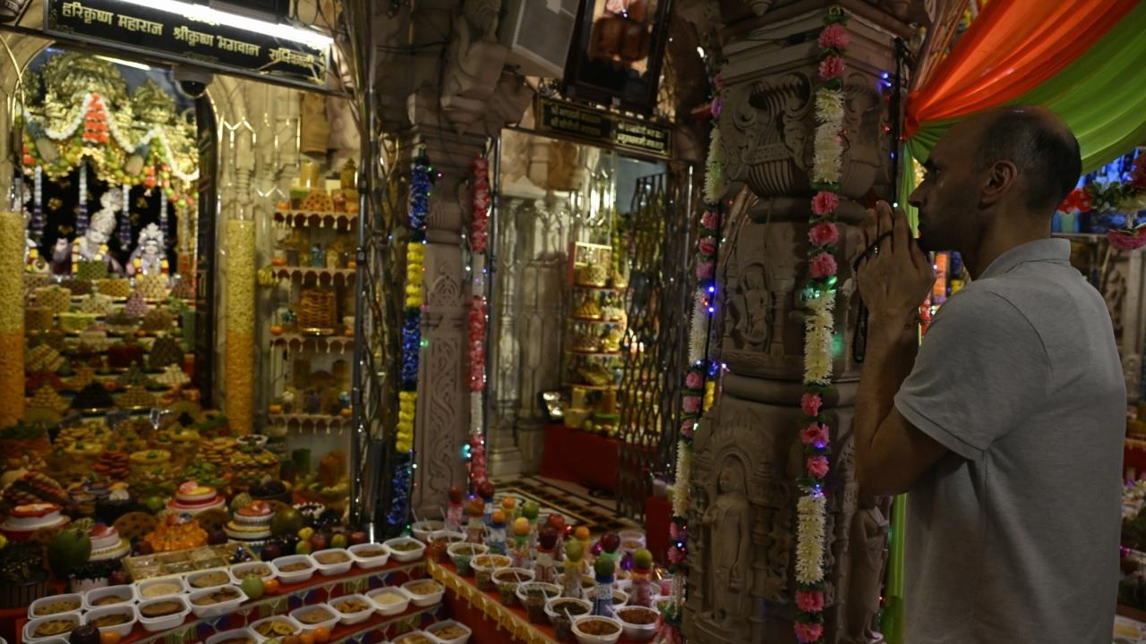 The temple premises were adorned with colorful decorations and lights, creating a festive atmosphere