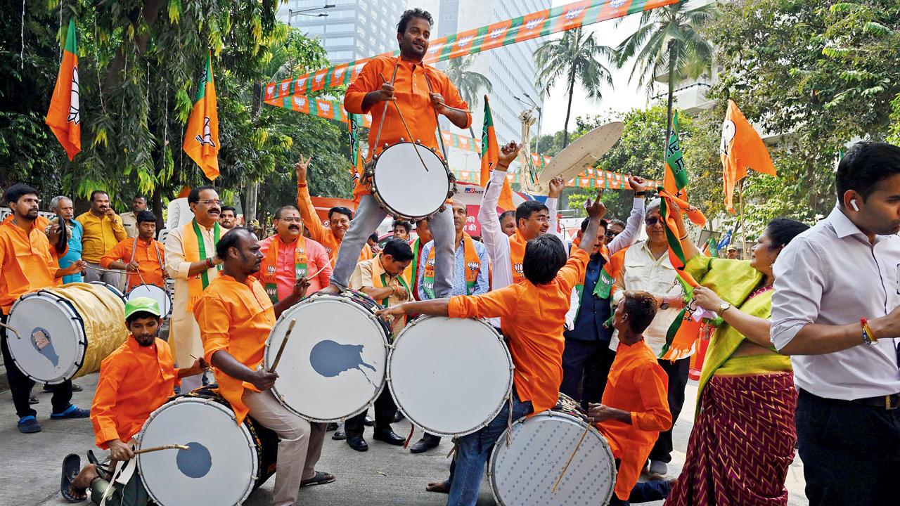 BJP workers celebrate the party’s resound victory at the Nariman Point office on Saturday. Pics/Atul Kamble