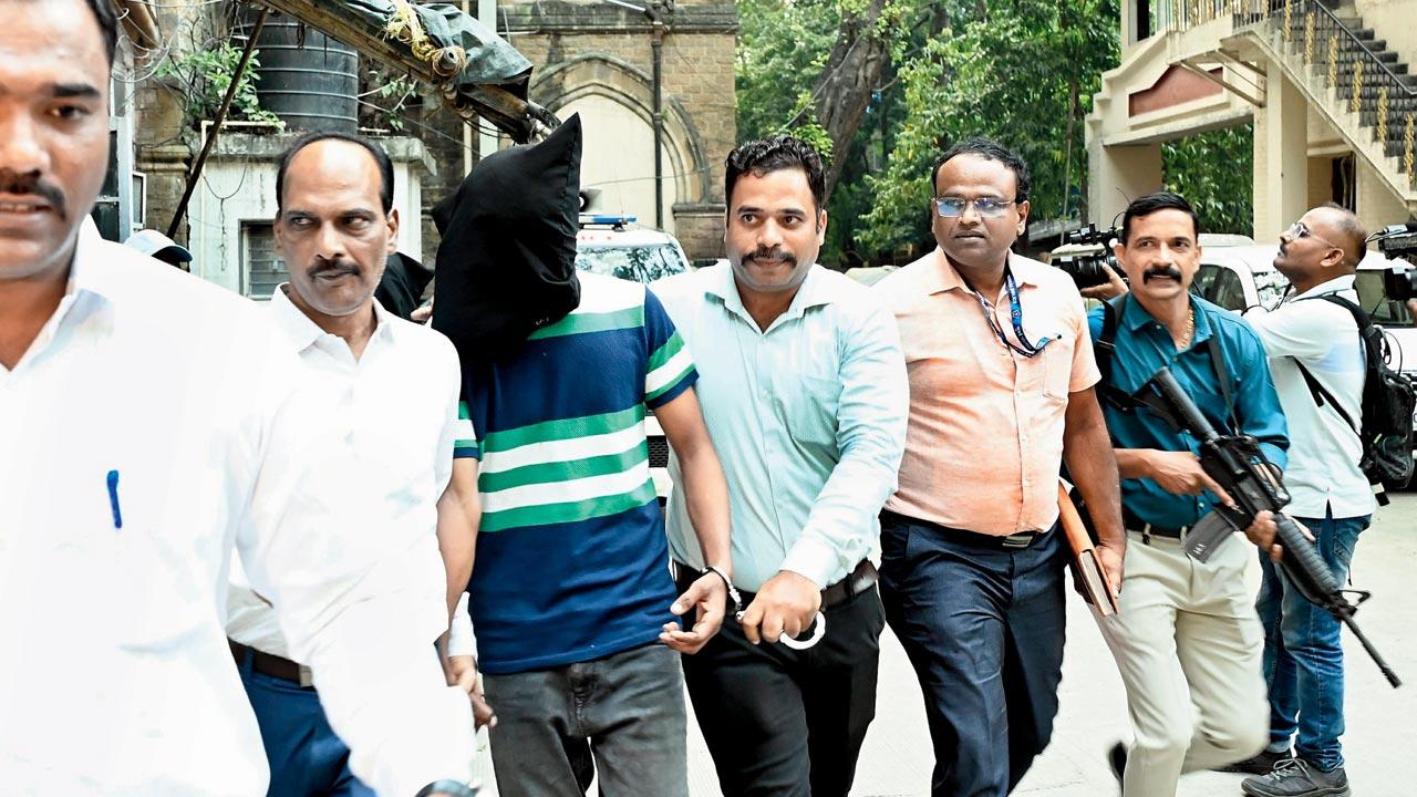 Shivkumar Gautam being produced in court. File pic/Ashish Raje