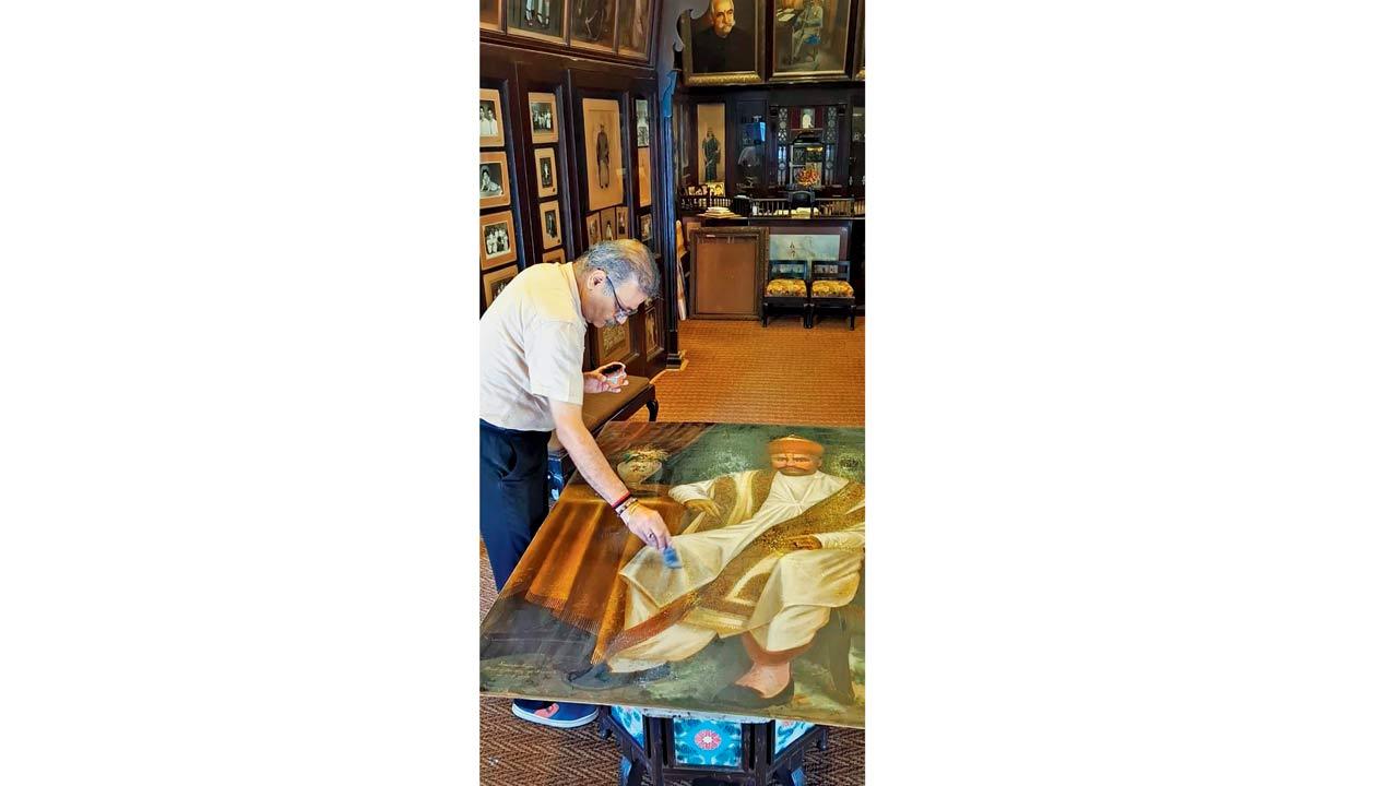 Anil Chaddha touching up Soonderdas Jaitha’s portrait. Pic Courtesy Indian Art Studio