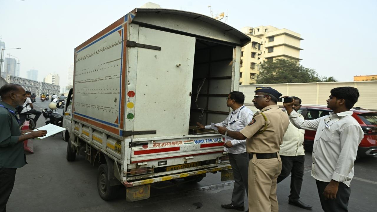 An SST team checks a vehicle at Lower Parel bridge